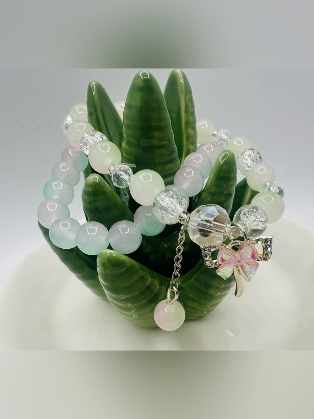 Pastel Pink and Mint stretch Bead Bracelet with Bow Charm - set of two